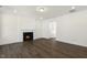 Cozy living room with a fireplace and hardwood floors, perfect for relaxation at 82 Gander Dr, Benson, NC 27504