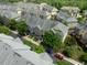 Aerial view of townhomes, showing parking and landscaping at 128 Dove Cottage Ln, Cary, NC 27519
