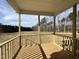 A new wooden back porch features a scenic view of the outdoors at 234 Danube Dr, Zebulon, NC 27597