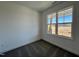 Carpeted bedroom features natural light from a large window offering pleasant neighborhood views at 234 Danube Dr, Zebulon, NC 27597