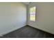 This bedroom features neutral walls, carpet, and a window with outside views at 234 Danube Dr, Zebulon, NC 27597