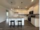Modern kitchen featuring white cabinets, stainless steel appliances, and a granite island at 234 Danube Dr, Zebulon, NC 27597