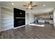 Spacious living area featuring a fireplace, custom shelving, and an open layout flowing into the kitchen at 234 Danube Dr, Zebulon, NC 27597