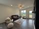 Bright living room with natural light, comfortable seating, and stylish decor at 234 Danube Dr, Zebulon, NC 27597