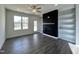 Bright living room showcasing a fireplace with built-in shelving and access to an outdoor area at 234 Danube Dr, Zebulon, NC 27597