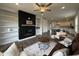 Open living room with fireplace, built-in shelving, and seamless kitchen integration at 234 Danube Dr, Zebulon, NC 27597
