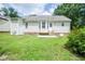 This backyard shows a patio area, perfect for outdoor seating and entertaining at 310 E Horton St, Zebulon, NC 27597