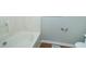 Close-up view of the bathtub and toilet, with fresh paint and neutral accents at 310 E Horton St, Zebulon, NC 27597