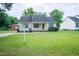 Charming one-story home featuring a well-manicured lawn, classic design, and inviting curb appeal at 310 E Horton St, Zebulon, NC 27597