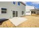 Newly constructed home with small patio and yard at 26 Steppe Way, Garner, NC 27529