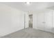 Bedroom with carpet, door to bonus room and double doors at 26 Steppe Way, Garner, NC 27529