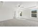 Bright bedroom featuring carpet and two windows at 26 Steppe Way, Garner, NC 27529