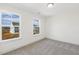 Bedroom with two windows and view of the neighborhood at 26 Steppe Way, Garner, NC 27529
