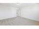 Simple bedroom with carpet and door to hallway at 26 Steppe Way, Garner, NC 27529