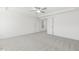 Well-lit bedroom with carpet flooring and access to another room at 26 Steppe Way, Garner, NC 27529