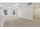 Spacious bonus room with carpeted floor and ceiling fan at 26 Steppe Way, Garner, NC 27529