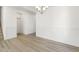 Bright dining room with hardwood floors and wainscoting at 26 Steppe Way, Garner, NC 27529