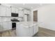 Modern kitchen with island and gray cabinets at 26 Steppe Way, Garner, NC 27529