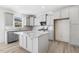 Modern kitchen with gray cabinets and granite countertops at 26 Steppe Way, Garner, NC 27529