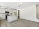 Modern kitchen featuring an island and gray cabinets at 26 Steppe Way, Garner, NC 27529