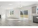 Open concept kitchen with view of backyard and sliding glass door at 26 Steppe Way, Garner, NC 27529