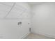 Laundry room with shelving and tile floor at 26 Steppe Way, Garner, NC 27529