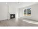 Bright living room with fireplace and large window at 26 Steppe Way, Garner, NC 27529