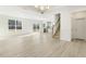 Open living room with kitchen and stairs view at 26 Steppe Way, Garner, NC 27529