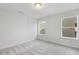 Simple bedroom with neutral walls and carpet at 36 Steppe Way, Garner, NC 27529