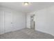 Spacious bedroom with carpet, door to bathroom and hallway at 36 Steppe Way, Garner, NC 27529