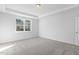 Well-lit bedroom with a window overlooking neighboring houses at 36 Steppe Way, Garner, NC 27529