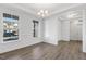 Dining room with hardwood floors, wainscoting, and chandelier at 36 Steppe Way, Garner, NC 27529