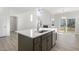 Open concept kitchen with island and stainless steel appliances at 36 Steppe Way, Garner, NC 27529