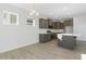 Modern kitchen with dark cabinets and large island at 36 Steppe Way, Garner, NC 27529
