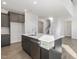 Modern kitchen with dark cabinets and large island at 36 Steppe Way, Garner, NC 27529