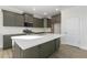 Modern kitchen with dark cabinets and a large island at 36 Steppe Way, Garner, NC 27529