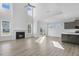 Open living space with kitchen, fireplace, and hardwood floors at 36 Steppe Way, Garner, NC 27529