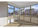 Screened porch with wood decking and views of neighboring houses at 36 Steppe Way, Garner, NC 27529