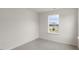 Bedroom with carpeted floor and window at 156 Perseus St, Angier, NC 27501