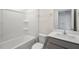 Bathroom with a shower/tub combo and gray vanity at 160 Perseus St, Angier, NC 27501