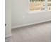 Spacious bedroom with neutral carpeting and large window at 160 Perseus St, Angier, NC 27501