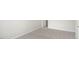 Bright bedroom with neutral carpeting and door to bathroom at 160 Perseus St, Angier, NC 27501