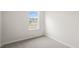 Simple bedroom with carpeted floor and a window at 160 Perseus St, Angier, NC 27501