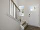 Inviting entryway with staircase, hardwood floors, and natural light at 160 Perseus St, Angier, NC 27501