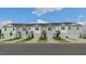 New townhome community with attached garages and well-manicured lawns at 160 Perseus St, Angier, NC 27501