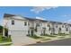 Row of townhouses with attached garages and landscaping at 160 Perseus St, Angier, NC 27501
