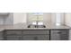 Granite kitchen island with double sink and dishwasher at 160 Perseus St, Angier, NC 27501