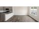 Open concept kitchen and dining area with hardwood floors at 160 Perseus St, Angier, NC 27501