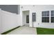 Side view of townhouse exterior with private entrance and fenced yard at 160 Perseus St, Angier, NC 27501