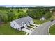 Aerial view of townhouses with a pond and surrounding trees at 168 Perseus St, Angier, NC 27501